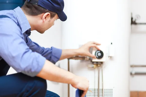 Technician Adjusting Water Heater | Alco Air